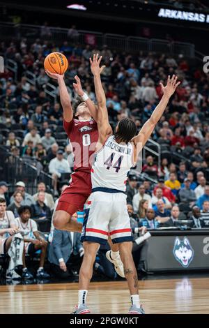 Arkansas Razorbacks guard Anthony Black (0) shoots over Connecticut Huskies guard Andre Jackson Jr. (44) during a NCAA men’s basketball tournament gam Stock Photo