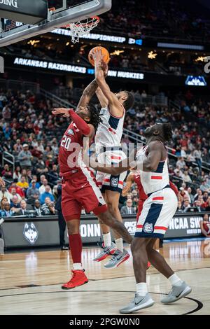 Connecticut Huskies guard Andre Jackson Jr. (44) fights for a rebound with Arkansas Razorbacks forward Kamani Johnson (20) during a NCAA men’s basketb Stock Photo