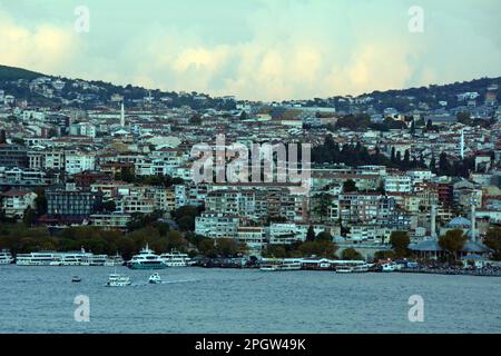 Looking across the Strait of Bosphorus from Beyoglu on the European side to Uskudar on the Asian side of Istanbul, Turkiye / Turkey. Stock Photo