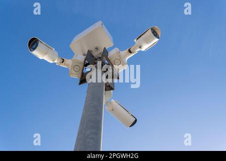 Three video surveillance security cameras in the street. Conceptual image of security Stock Photo