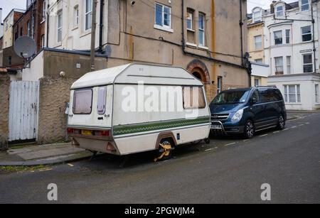 Old caravan parked on a street in Scarborough Stock Photo