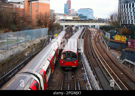 A Jubilee line tube train leaving Stratford station with another one entering Stock Photo