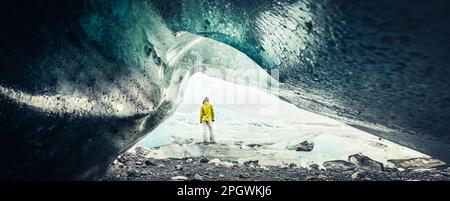Panoramic view of tourist by Fjallsjökull glacier in Iceland from inside glacier cave. Explore sightseeing Iceland hidden gems. Famous travel destinat Stock Photo