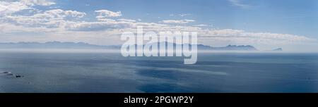 landscape with eastern shore of False Bay from Smitswinkel Bay view point, shot in  bright summer light,  Cape Town, Western Cape, South Africa Stock Photo