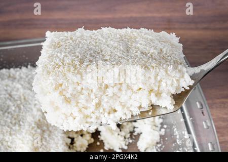 Couscous bowl, typical Brazilian dish, made with tapioca, milk, sugar and coconut milk. Cut from one piece. Stock Photo