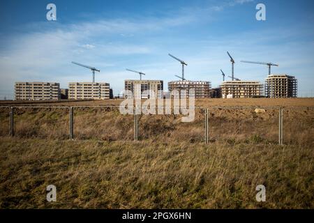Row of new build high rise apartments under construction - part of East Londons Barking Riverside housing development. Stock Photo