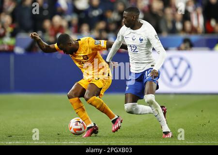 SAINT-DENIS - (lr) Lutsharel Geertruida of Holland, Randal Kolo Muani of France during the UEFA EURO 2024 qualifying match between France and Netherlands at Stade de France on March 24, 2023 in Saint-Denis, France. ANP MAURICE VAN STONE Stock Photo