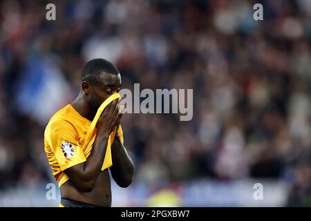 SAINT-DENIS - Lutsharel Geertruida of Holland reacts during the UEFA EURO 2024 qualifying match between France and the Netherlands at Stade de France on March 24, 2023 in Saint-Denis, France. ANP MAURICE VAN STONE Stock Photo