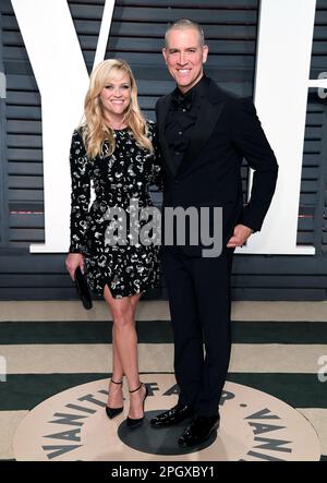 File photo dated 26/02/17 of Reese Witherspoon and husband Jim Toth arriving at the Vanity Fair Oscar Party in Beverly Hills, Los Angeles, USA. Ms Witherspoon and her husband Jim Toth said they have taken the 'difficult decision' to divorce after more than 10 years of marriage. The Legally Blonde actress Witherspoon, 47, has been married to talent agent Toth, 52, since 2011. Issue date: Friday March 24, 2023.