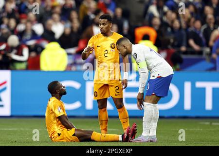 SAINT-DENIS - Lutsharel Geertruida of Holland, Jurrien Timber of Holland, Kylian Mbappe of France during the UEFA EURO 2024 qualifying match between France and Netherlands at Stade de France on March 24, 2023 in Saint-Denis, France. ANP MAURICE VAN STONE Stock Photo