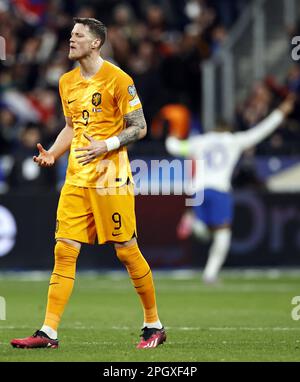 SAINT-DENIS - Wout Weghorst of Holland disappointed after Kylian Mbappe of France's 4-0 win during the UEFA EURO 2024 qualifying match between France and Netherlands at Stade de France on March 24, 2023 in Saint-Denis, France. ANP MAURICE VAN STONE Stock Photo