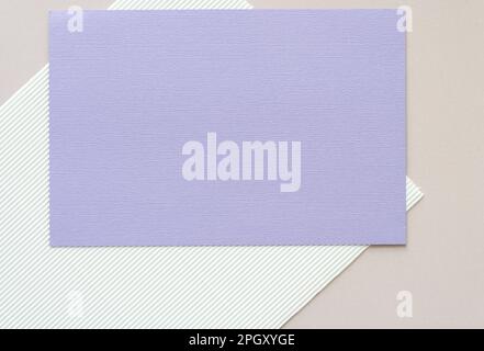 paper background featuring an isolated mauve card with texture Stock Photo