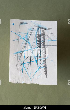 isolated note paper with lines and patterns on green Stock Photo