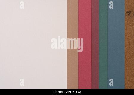 scrapbook paper background featuring layered sheets in various colours Stock Photo