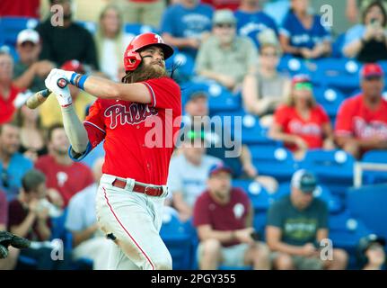 Philadelphia Phillies' Brandon Marsh takes off a batting glove