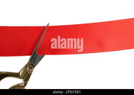 Cutting red ribbon with scissors on white background Stock Photo