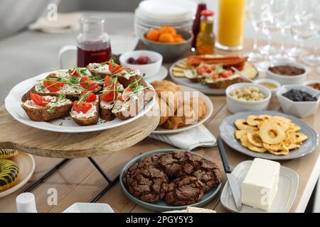 Brunch table setting with different delicious food indoors Stock Photo