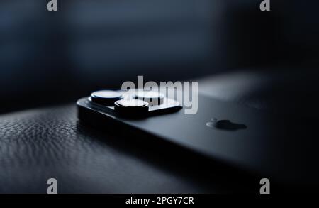 Closeup shot of a Apple iPhone 14 Pro on a dark background Stock Photo