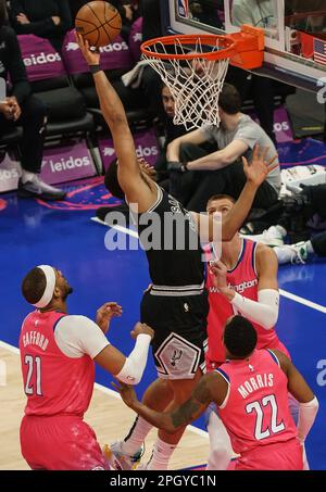 San Antonio Spurs forward Keldon Johnson (0) is pressured by Charlotte ...