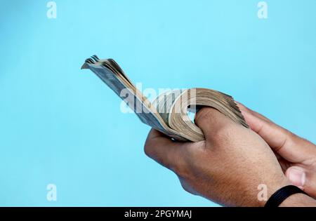 A Man Hand holding Rupees 500 bank note savings Stock Photo