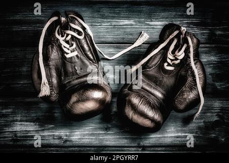 boxing gloves on blue wooden background Stock Photo