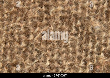 brown woolen fabric as background close up Stock Photo