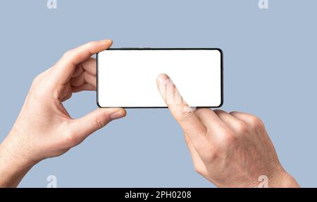 Mobile phone screen mock-up. Hands holding cellphone, pressing, clicking, touching play on smartphone screen display mockup. Stock Photo