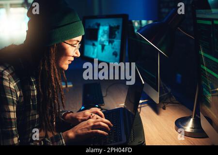 Woman, laptop and hacker typing in home with software, data programming or cybersecurity. Developer, it coder and female focus on hacking, phishing or Stock Photo