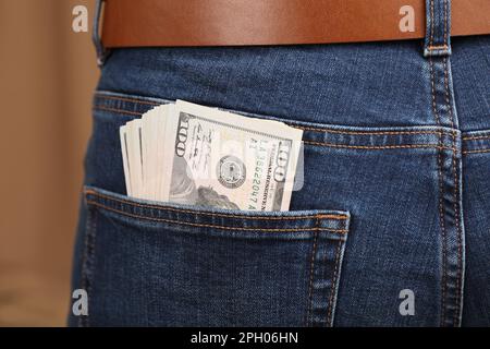 Dollar banknotes in pocket of jeans, closeup Stock Photo