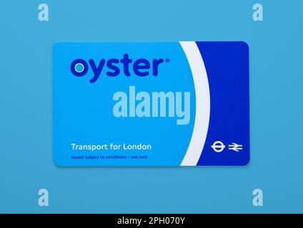 LONDON,UK - NOVEMBER 12, 2022: Oyster card on Blue background. Transport for london train ticket.Top view. Stock Photo