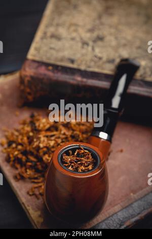 Smoking Library Smoking pipe and antique books. Tobacco pipe on ancient books. Relax by ...