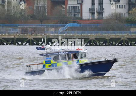 Met Police Marine Policing Unit boat Sir Robert Peel III MP9 heading up a choppy River Thames during a storm in London UK Stock Photo