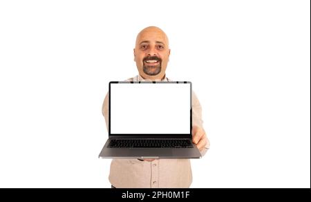 Cheerful positive man showing empty display of laptop. Isolated on white background, copy space. Internet advertising, web site, studio shot. Stock Photo