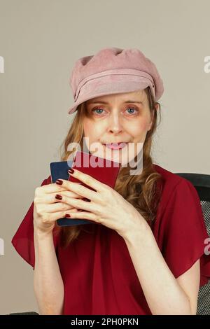 Woman holding two passports in her hands getting ready to cross international border Stock Photo