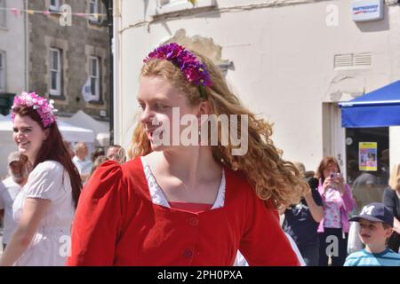 Members of Shaftesbury dance group Steps in Time enjoy performing a traditional dance during the town's Food and Drink Festival on 8th May 2022. Stock Photo