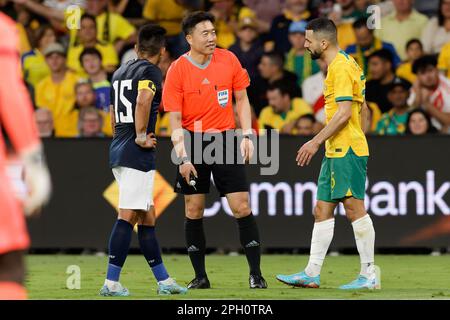 Referee, KIM Dae Yong talks with Aziz Behich of Australia during the match between Australia and Ecuador at CommBank Stadium on March 24, 2023 in Sydn Stock Photo