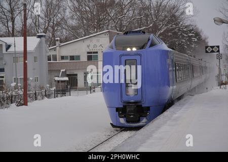 A Super Hokuto train (Series 281) stopped by the Hakodate Staion on the JR Hokkaido Hakodate Main Line in frozen winter. Stock Photo