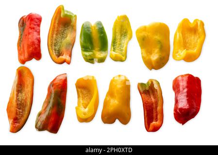 Sliced yellow green and red raw peppers isolated on white with clipping path included Stock Photo