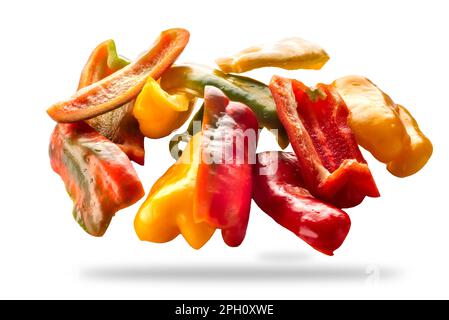 Sliced yellow green and red raw peppers isolated on white with clipping path included Stock Photo