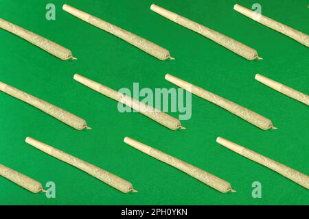 seamless pattern of twisted joints on a green background Stock Photo