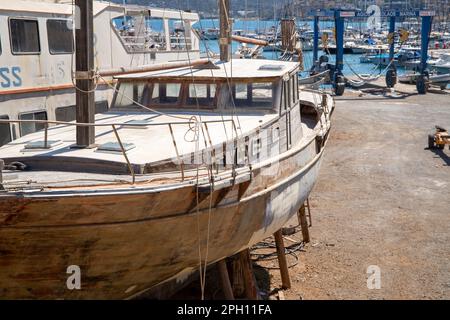 Old boat on land with rotten wood. High quality photo Stock Photo