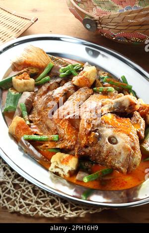 Asian cuisine tilapia fish curry Stock Photo