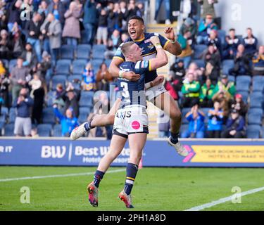 David Fusitu’a #2 of Leeds Rhinos celebrates with Harry Newman #3 of Leeds Rhinos after he scores a try during the Betfred Super League Round 6 match Leeds Rhinos vs Catalans Dragons at Headingley Stadium, Leeds, United Kingdom, 25th March 2023  (Photo by Steve Flynn/News Images) Stock Photo