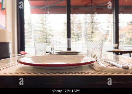 Served dinner table in a restaurant. Restaurant interior Stock Photo