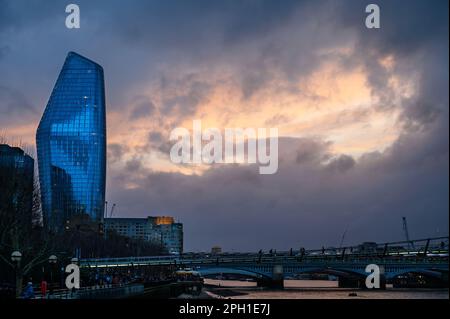 London, UK: One Blackfriars or The Boomerang, a distinctive mixed use tower in Southwark with a dramatic sky and River Thames. Stock Photo