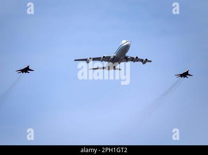 MOSCOW, RUSSIA - MAY 7, 2022: Avia parade in Moscow. MiG-29 and strategic bomber and missile platform IL-86 in the sky on parade of Victory in World W Stock Photo