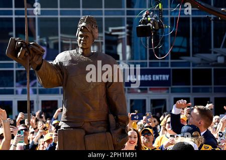 Former Nashville Predators goaltender Pekka Rinne, left, greets fans during  the unveiling ceremony of his statue before an NHL hockey game between the  Nashville Predators and the Seattle Kraken, Saturday, March 25