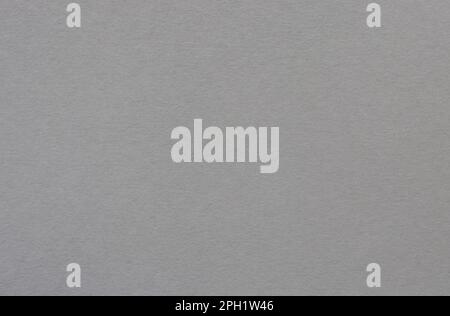 Dark gray colored tinted paper sheet background. Stock Photo