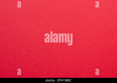 Bright red colored tinted paper sheet background. Stock Photo