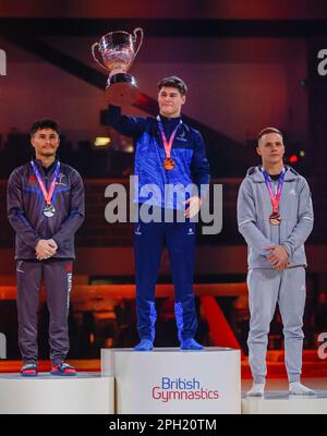 Exhibition Centre, Liverpool, UK. 25th Mar, 2023. British Gymnastics Championships Day 3; Men's Individual All-Around Final gold medallist - Adam Tobin (Falcons Gym Academy) (centre), silver medallist - Jake Jarman (Huntingdon Olympic) (left), bronze medallist - Pavel Karnejenko (South Essex GC) (right) Credit: Action Plus Sports/Alamy Live News Stock Photo